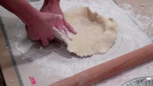 lining a pan with gluten free pie crust